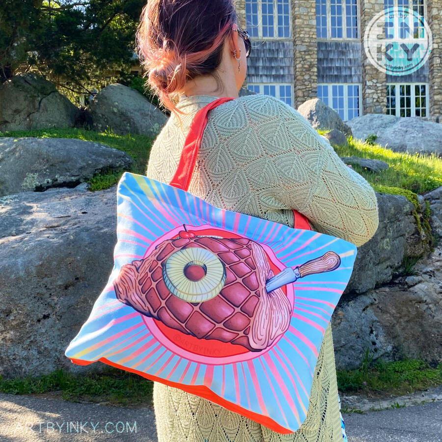 Rum Ham Tote Bag Person holding a large rum ham tote bag over their shoulder with rocks and a stone building in the background.