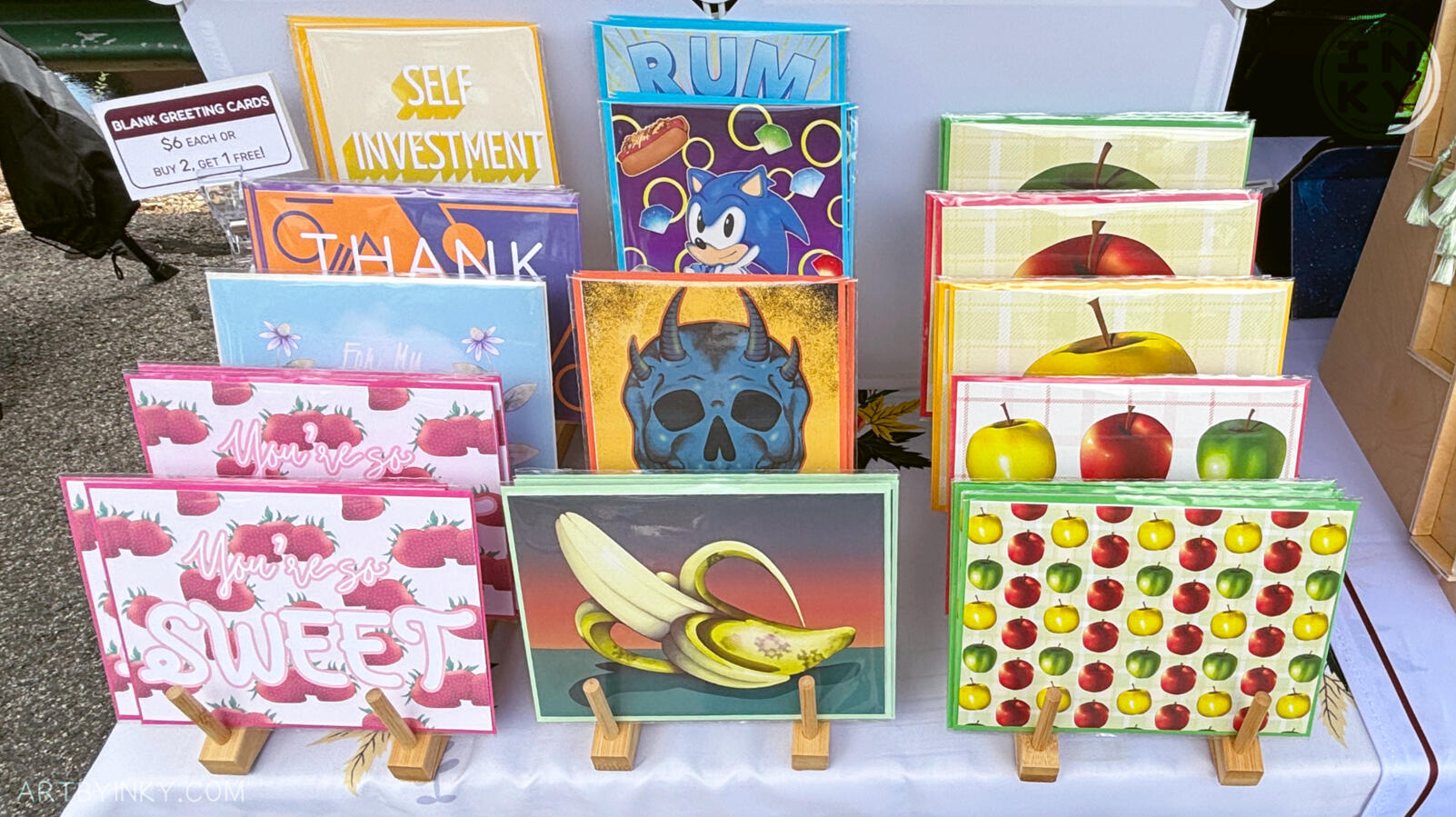 Front Booth Close Up- Cards Front view of the booth layout at an outdoor market showing greeting cards.